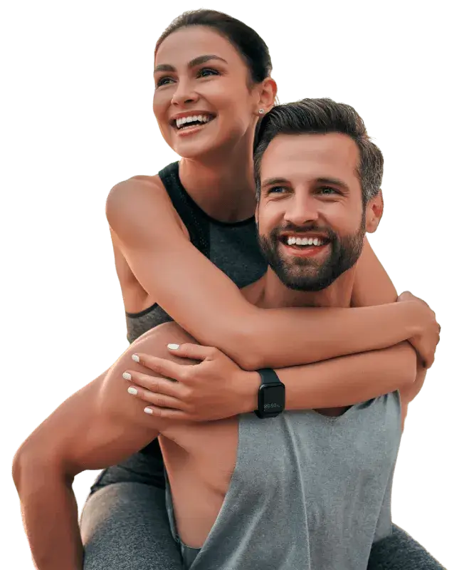 Young and in shape couple smiling while wearing gym clothes | Aesthetics/ Anti-Aging | Coastal Facial Rejuvenation & Body Sculpting